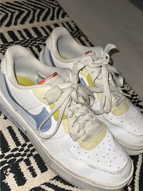 Nike White Leather Sneakers with Blue and Yellow Accents